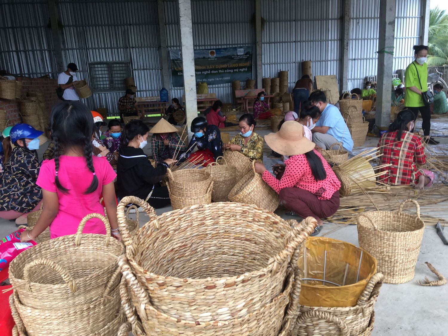 Local farmers produce traditional products from bulrush in shrimp ponds in Phu My, Kien Giang Province