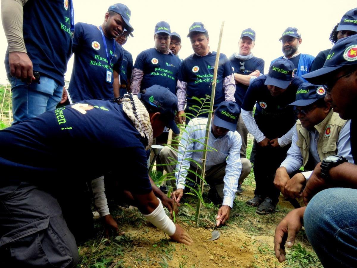 Chief Guest of the event Mr. Mohammad Abul Kalam, NDC, Additional Secretary of the Bangladesh Government (centre) plants a tree in Cox’s Bazar District, Bangladesh 