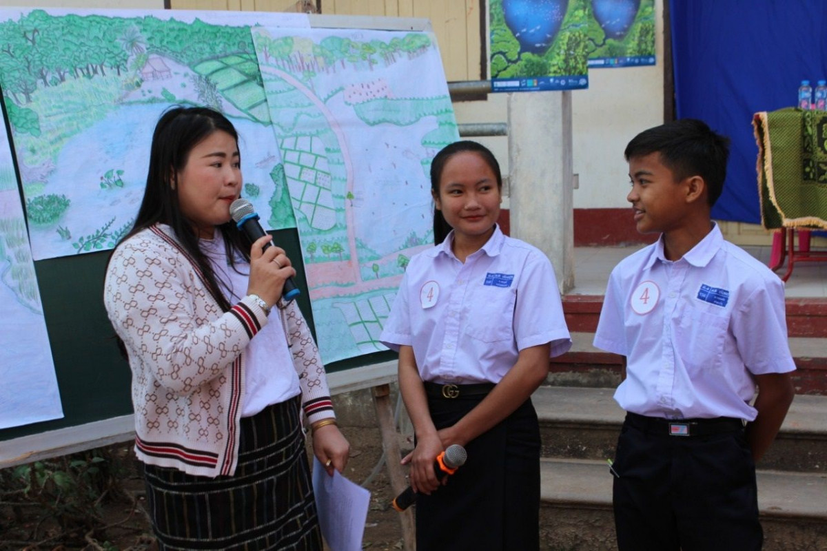 Students explain their drawings for the wetland art competition in Lao PDR