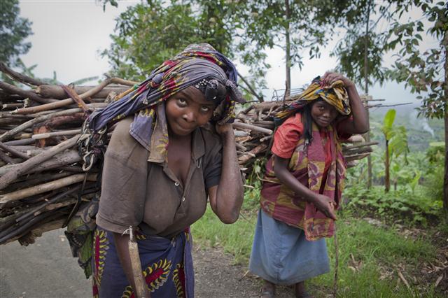Local women in the Great Lakes area carrying firewood