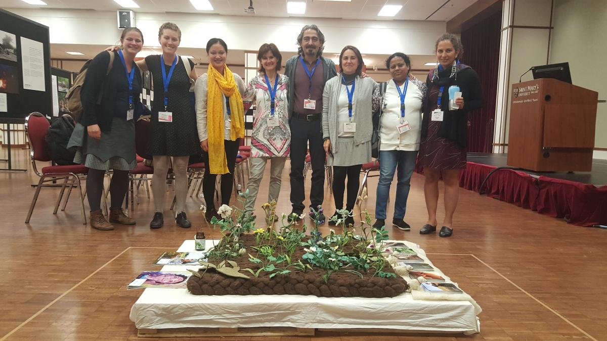 Participants with an art piece at the Communities, Conservation and Livelihoods conference