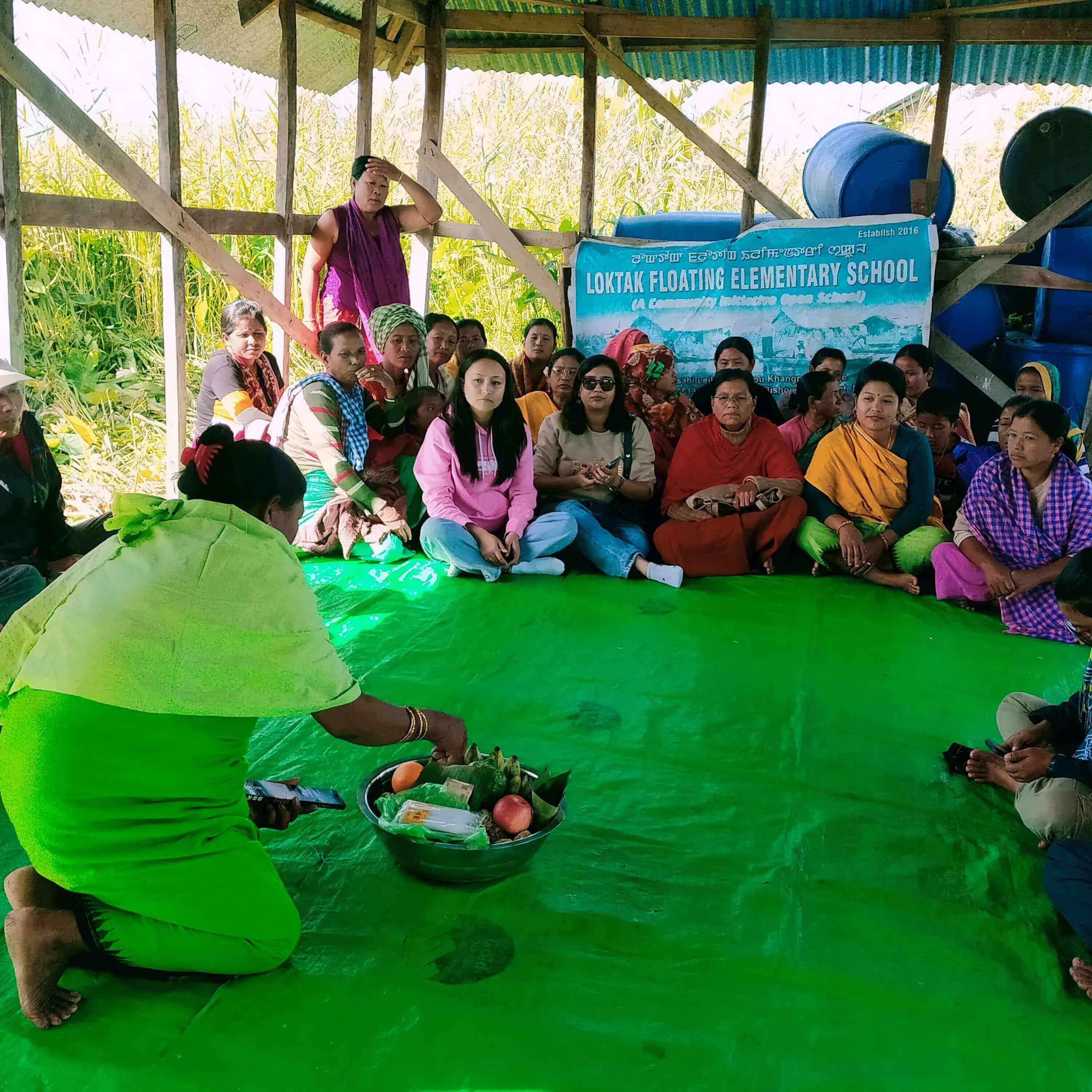 Women fishers gather at Champu Khangpok Floating Village, Loktak Lake in Manipur (India).