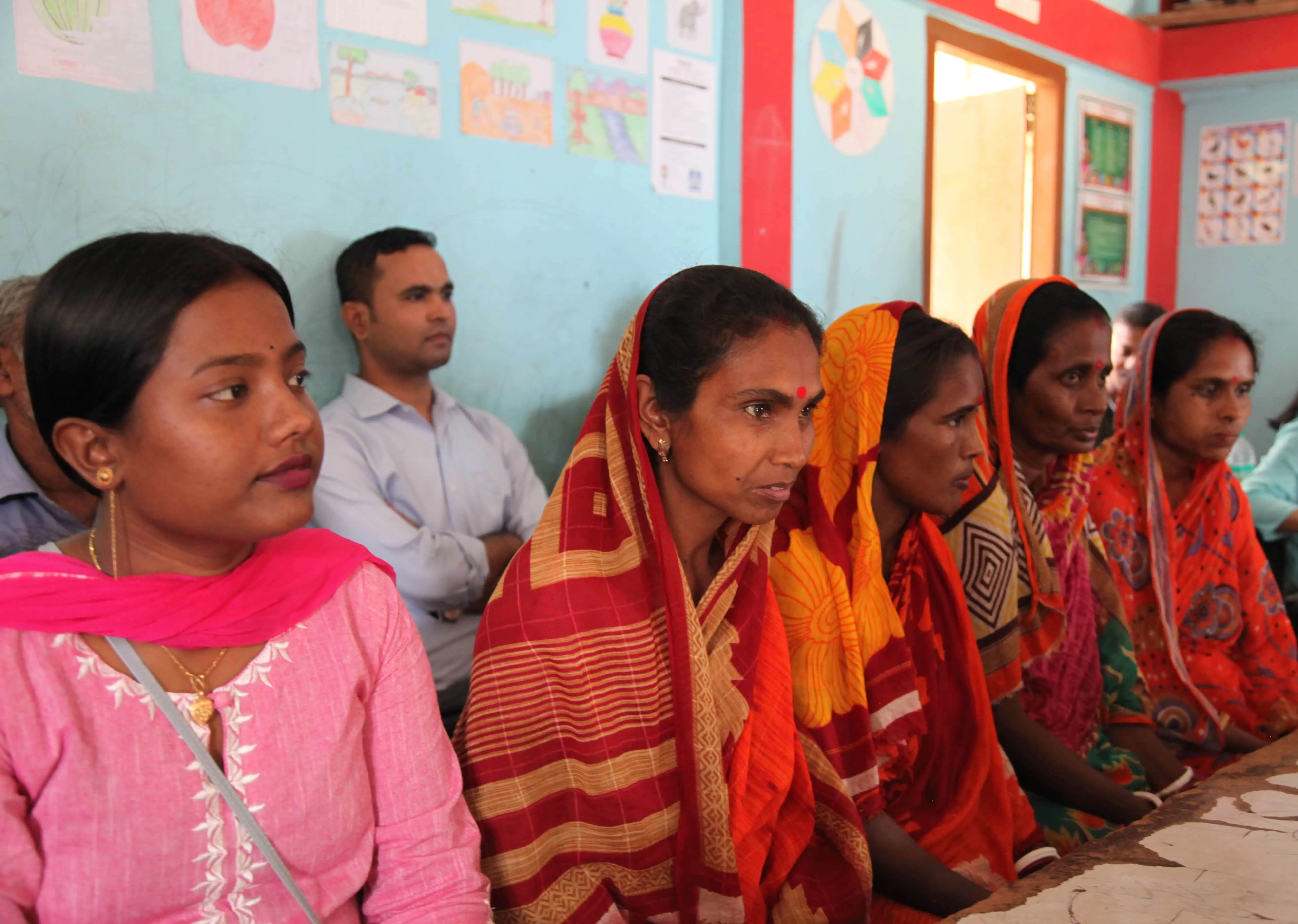 5 women sitting in a classroom-style training room