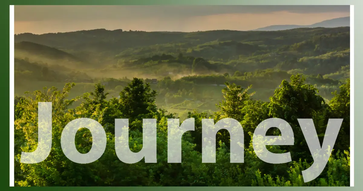 Fog over forest and hills with word Journey on top
