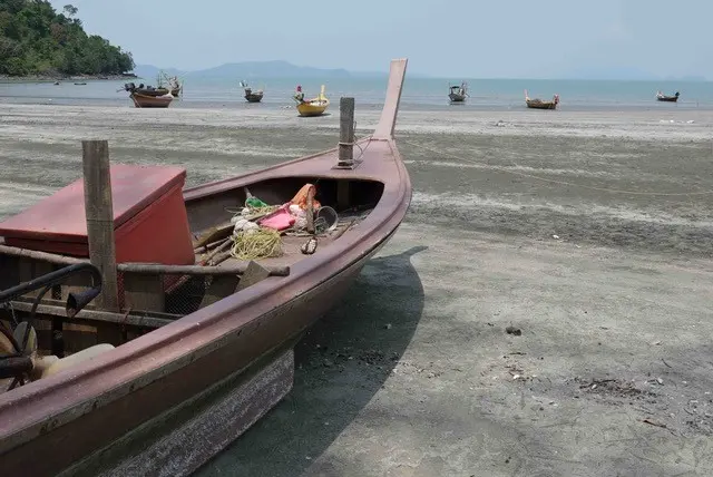 Small-scale fishing boats on the beach in Thailand