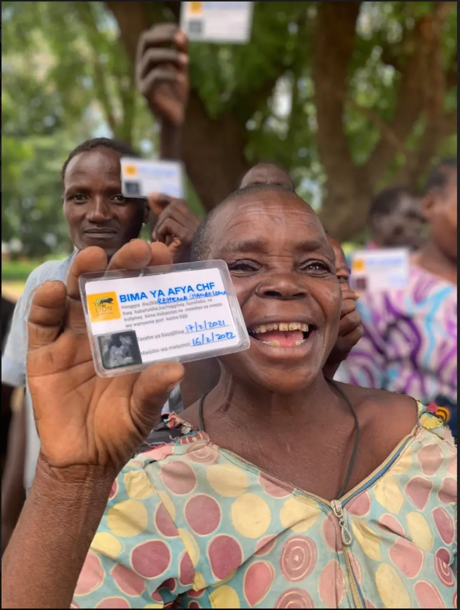 Villagers celebrating getting healthcare coverage as a result of the community camera-trapping initiative